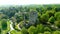 Aerial orbit view of iconic Blarney Castle and Gardens area, Co. Cork, Ireland