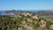 Aerial orbiting parallax shot of cliffs on top of mountain in Peguera, Mallorca, Spain