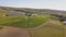 Aerial over grape vines and lush valley