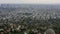 AERIAL: Over Griffith Observatory with Los Angeles, California Skyline in background in Daylight,Cloudy
