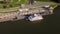 Aerial Over Large River Boat Docked Orbit