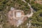 Aerial overhead drone shot of helipad heliport on hill of Vis Island in Adriatic sea in Croatia summer time