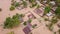 Aerial overhead flooded village and shacks