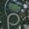 Aerial overhead shot of particular double circle 720 degree flyover in bushes residential buildings in Chongqing, China