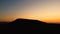 Aerial panning clip of a beautiful sunset view over the volcanic mountains of Fuerteventura