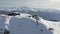 Aerial panning drone view from above scenery alpine ski resort with ropeway cabin and relaxing people tourist. Amazing