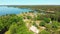 Aerial panning view beautiful iconic St.Joseph wooden stave church with no nails in famous Lithuania countryside holiday Village