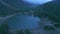 Aerial panning view popular green Pisang lake in Gandaki, Nepal. Tourist group sightseeing beautiful lake. Lower Pisang