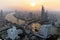 Aerial panorama of Bangkok at dusk with busy traffic on Taksin Bridge, boats & ferries on Chao Phraya River and skyscrapers