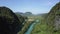 Aerial panorama canyon with river and road against valley