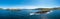 Aerial panorama of the coastal landscape of the Iveragh Peninsula with Beginish and Valentia Island Lighthouse