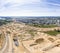 Aerial panorama of construction site near city residential area