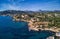Aerial panorama of Costa de la Calma shoreline and turquoise clear green water of Mediterranean Sea. Hillside villas between pine