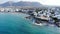 Aerial panorama on Crete coast, city and resort life, offshore waves