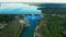 Aerial panorama of Dam at reservoir with flowing water, hydroelectricity power station, drone photo