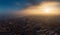 Aerial panorama of dramatic sunset above evening Voronezh city in haze or fog, bird eye view of urban downtown architecture