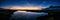 Aerial panorama Early Sunrise over Northern Sweden. Noctilucent night clouds, summer foggy lake reflects sky