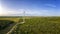 Aerial panorama of farm land with wind turbine farms.