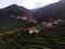 Aerial panorama of green agriculture farming terraces old remote rural mountain village town Porta Cova Portugal