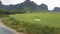 Aerial panorama green peanut field near turquoise river