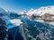 Aerial panorama image of the frozen lake of Silsersee with Isola and Maloja