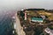 Aerial panorama of lighthouse on thousand of Gelendzhik city, sea resort at black sea for summer travel and tourism, coastline