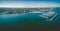 Aerial panorama of Middle Brighton Marina, coastline, and suburb