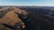 Aerial panorama with mountain scenery with Pueblo Sun Temple ruins on the edge of the cliff in the foreground