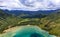 Aerial panorama of Oahu coastline, mountains in Honolulu Hawaii from helicopter