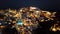 Aerial panorama of Oia town at night, Santorini