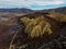 Aerial panorama of Omarama Clay Cliffs geological natural erosion silt and sand rock formation in Canterbury New Zealand