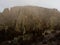 Aerial panorama of Omarama Clay Cliffs geological natural erosion silt and sand rock formation in Canterbury New Zealand