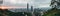 Aerial panorama over Downtown Taipei with Taipei 101 Skyscraper with trees on mountain in foreground in the dusk from Xiangshan.