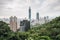 Aerial panorama over Downtown Taipei with Taipei 101 Skyscraper with trees on mountain in foreground from Xiangshan.