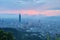 Aerial panorama of overpopulated Taipei City at dusk