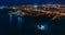 Aerial panorama of Paphos at night, Cyprus seaside from above. Beautiful evening mediterranean seascape with illuminated