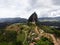 Aerial panorama of Piedra Del Penol El Penon de Guatape rock stone inselberg monolith granite dome in Antioquia Colombia
