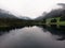 Aerial panorama reflection of alpine mountain lake Hintersee clouds mood Ramsau Berchtesgadener Land Bavaria Germany