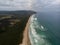 Aerial panorama of sand coast pacific ocean sea shore Opoutere beach waves Waikato Coromandel Peninsula New Zealand