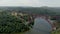 Aerial panorama shooting of the beautiful red railway bridge over the river