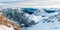 Aerial panorama of snow-covered rocky mountains