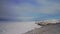 Aerial panorama. Snow hill, ice coastline. Winter frozen scenery, cold sunshine