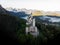 Aerial panorama sunrise view of bavarian alpine mountain landscape with Neuschwanstein fairytale castle Fuessen Germany