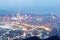 Aerial panorama of Taipei downtown & suburbs at dusk with view of Keelung Riverside Park