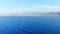 Aerial panorama from top on blue sea, yacht and water bike, Crete, Greece