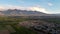 Aerial panorama of the town of Kochkor, Kyrgyzstan and surrounding fields and mountains