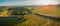 Aerial panorama of Tuggeranong Parkway passing near National Arboretum and Lake Burley Griffin in Canberra, Australia.