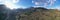 Aerial panorama of valley, morning fog over mountains, Twisting road, Tops and slopes of mountains