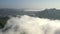 Aerial panorama view. Beautiful green mountain slope surrounded by cloud