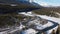 Aerial panorama view of Bow River valley forest in winter. Snowcapped Canadian Rockies. Alberta, Canada.